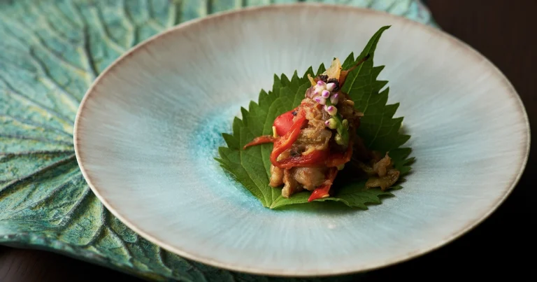 Thai snack "Miang Kham" wrapped in Japanese Shiso leaf.